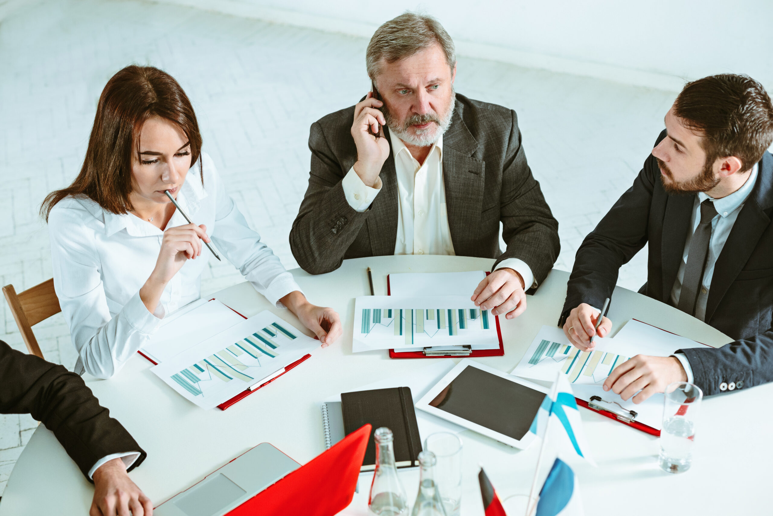 The business people working together at table. The meeting or summit concept